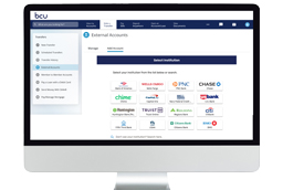 Man with glasses looking at laptop